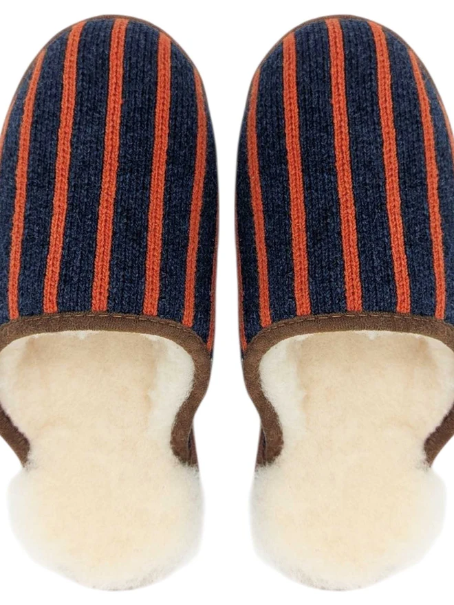 NAVY AND TERRACOTTA STRIPED SLIPPERS ON A WHITE BACKGROUND