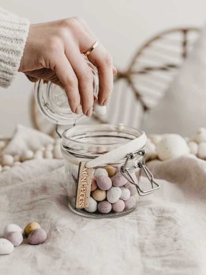 jar of mini eggs with a ceramic 'mini eggs' tag tied around it