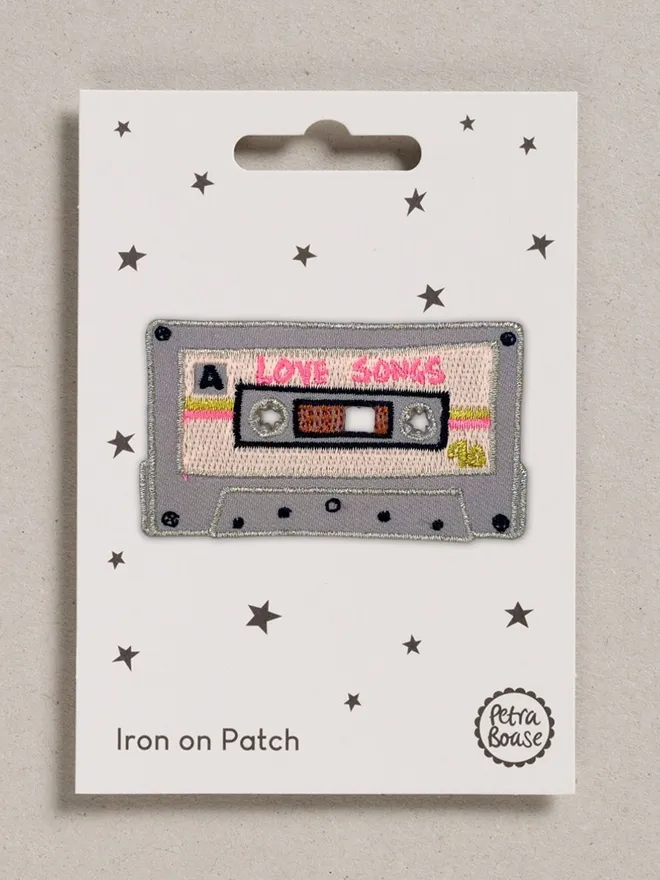 Love songs retro tape embroidered fabric patch with an iron-on backing.