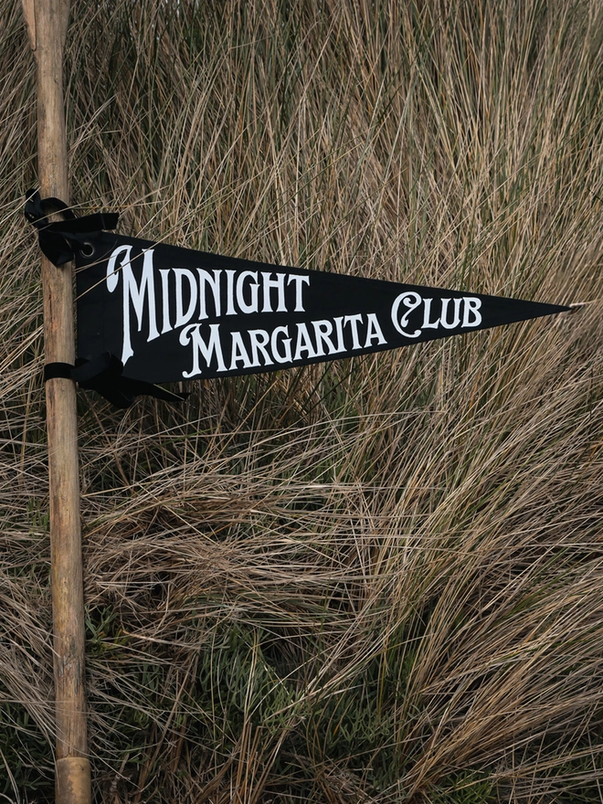 Black flag with white writting Midnight Margarita Club 