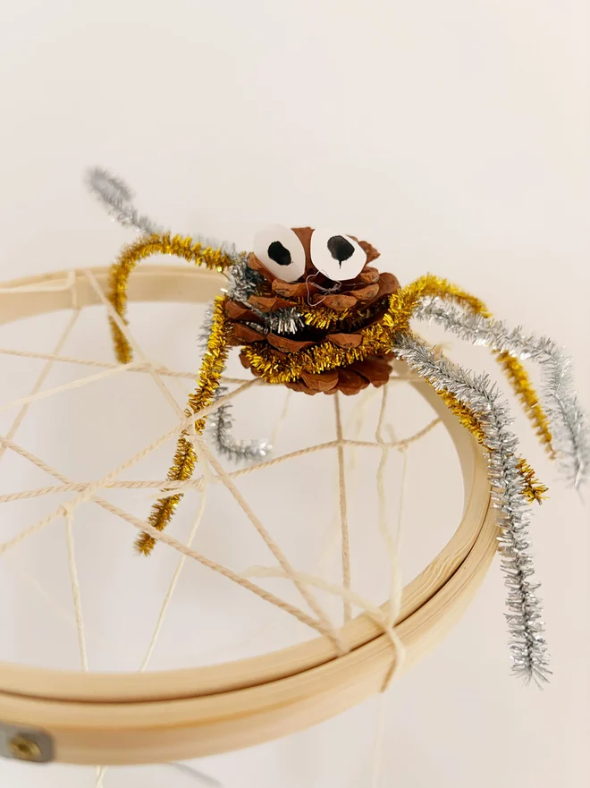 A Hanging Halloween Decoration Spider Pine Cone
