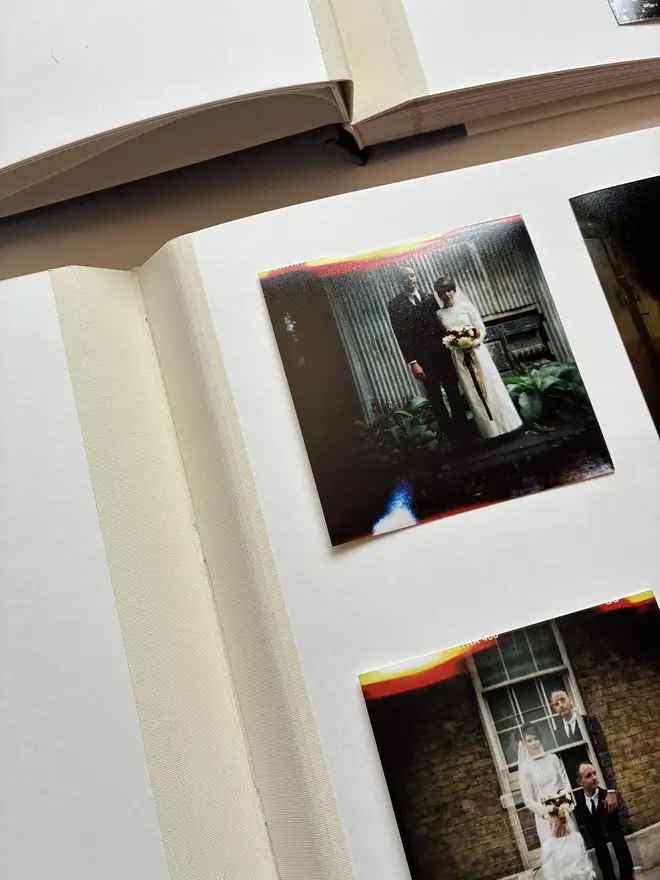 Open hand made traditional cloth jointed photograph album by Keep Collect