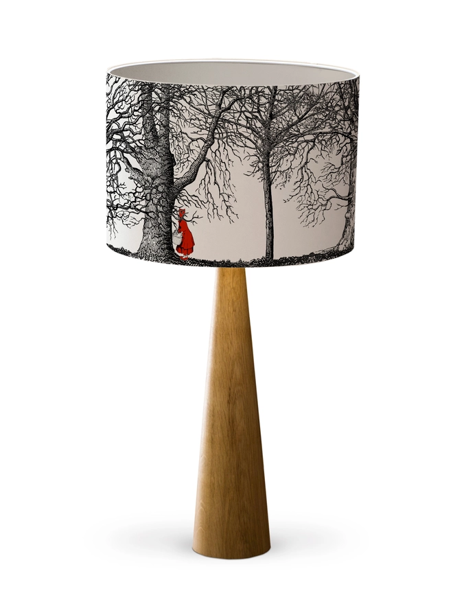 Handmade drum lampshade featuring a whimsical Little Red Riding Hood inspired design with a red cape, big bad wolf, and dark woodland scene.