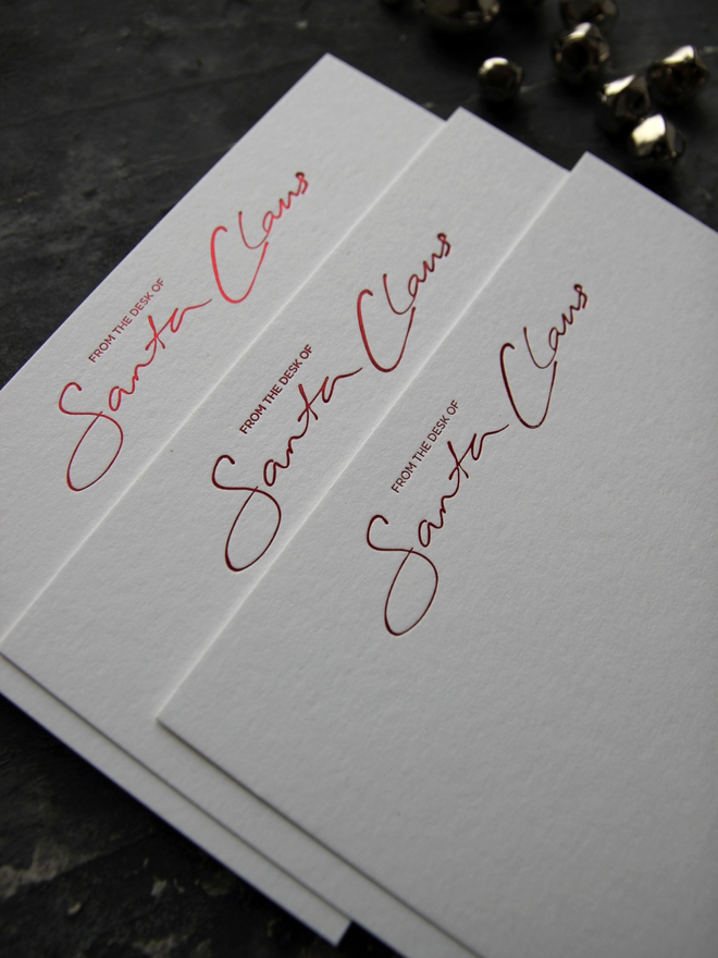 From The Desk Of Santa Claus notecards hand foiled in red text with an envelope that says North Pole Mail