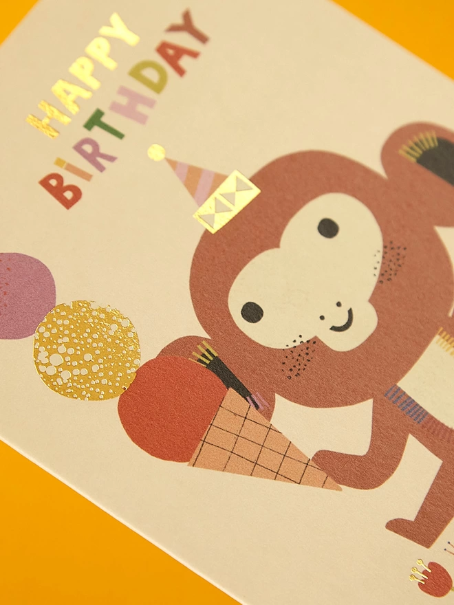 Detail image of the special gold foil details on the Raspberry Blossom children’s birthday card