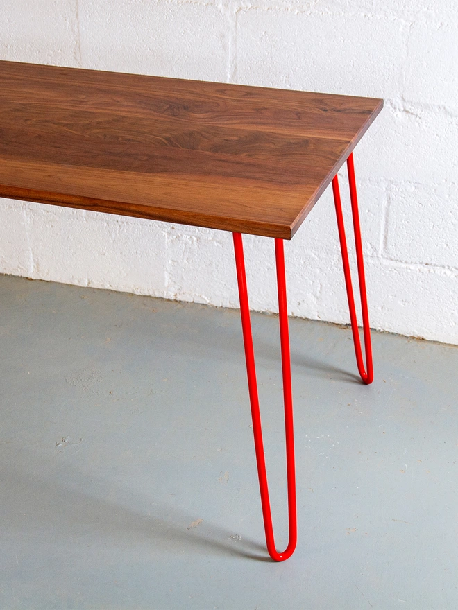 hairpin leg table with walnut top and red legs