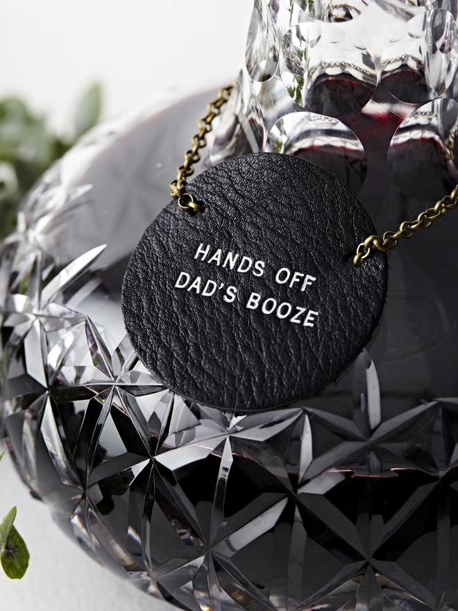 black leather bottle tag