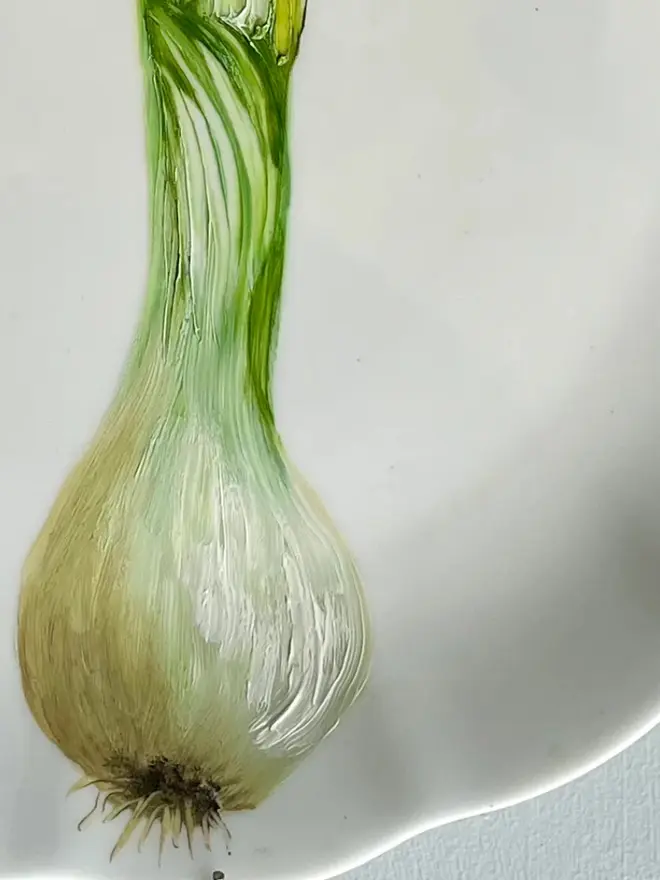 Zoom-in on Oil Painted Large Spring Onions On Vintage Cake Plate. 