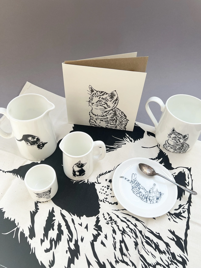 Cat collection including ceramics, big card and the Cuddle time tea towel