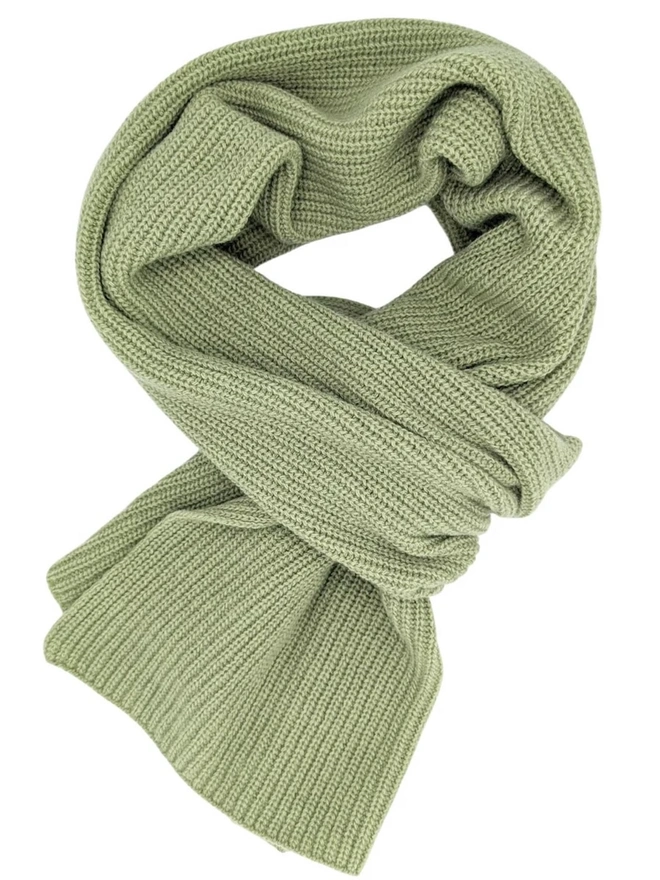 Lambswool Ribbed Scarf, a colourful ribbed scarf siting on a plain white surface. 