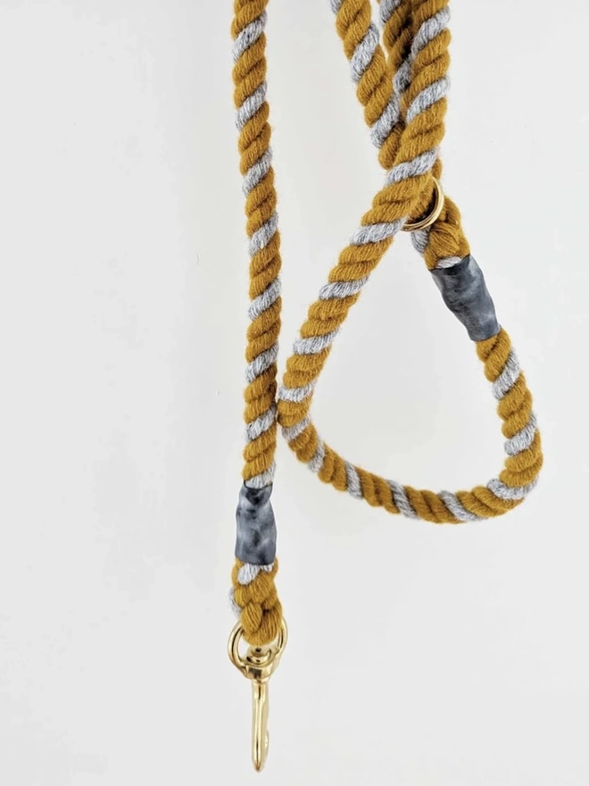 Wool Twist Dog Lead, a wool dog lead hanging on a wooden peg. 
