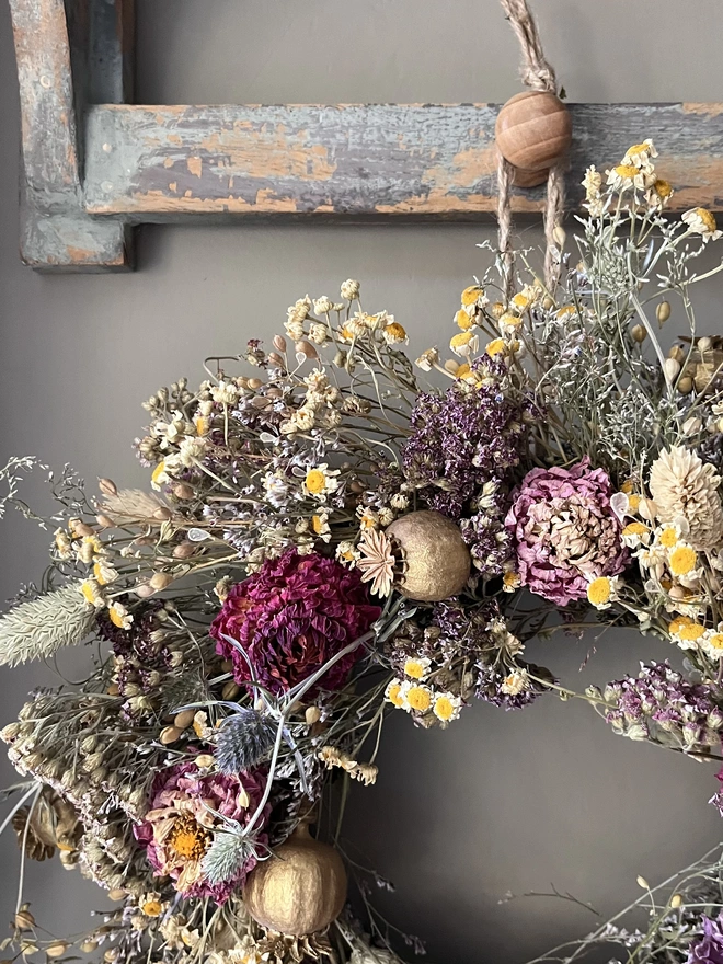 Autumnal dried flower wreath made with a range of seasonal flowers