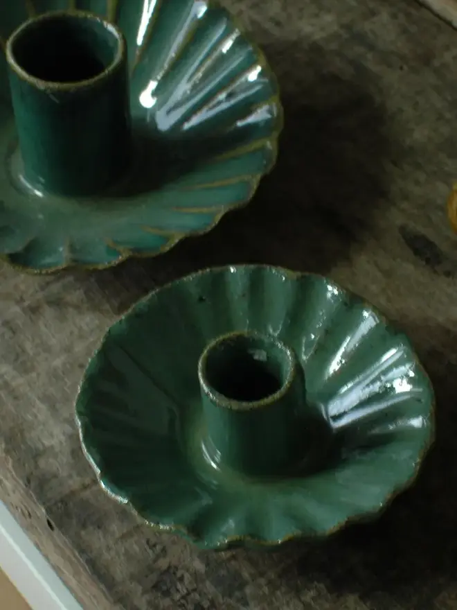 Handmade Green Ceramic Candlestick Holder, a pair of green candlestick holders sitting on a wooden surface. 
