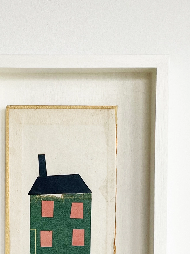 A charming dark green townhouse portrait using vintage paper on an old book cover.