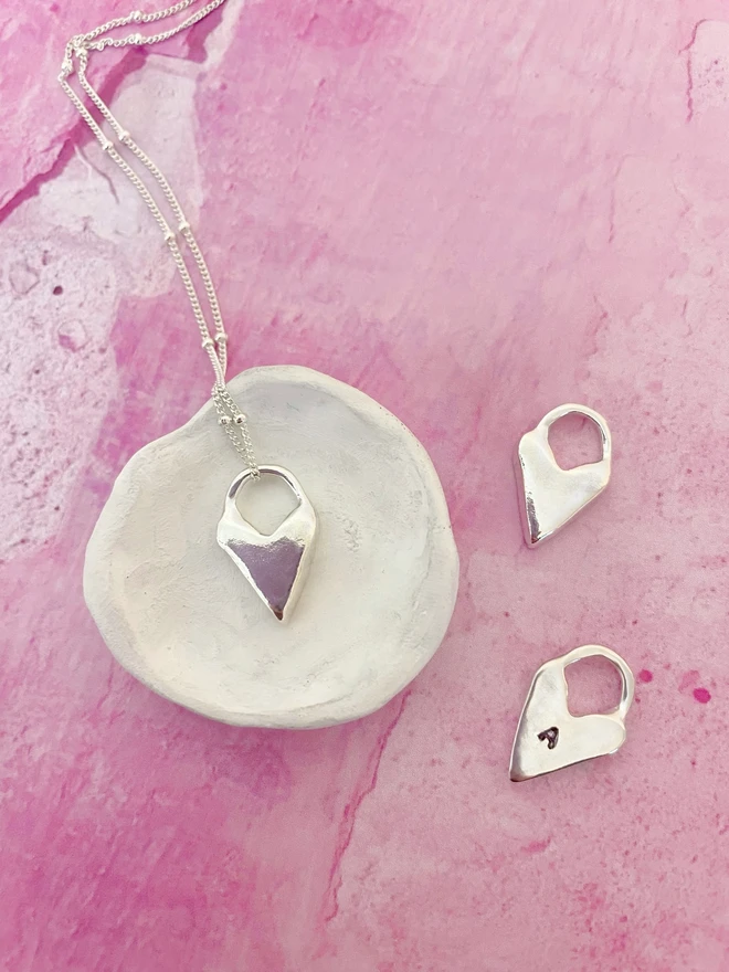 Hand made heart talisman charms made from 100% recycled sterling silver, cute gift for girlfriend or wife for Valentine's Day or Mother's Day. Send straight to your special someone. Made by Celina C Jewellery, a small business in the UK, find on Holly and Co.