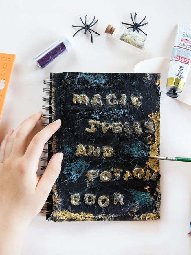 Halloween creative activity for children - create your own spell book