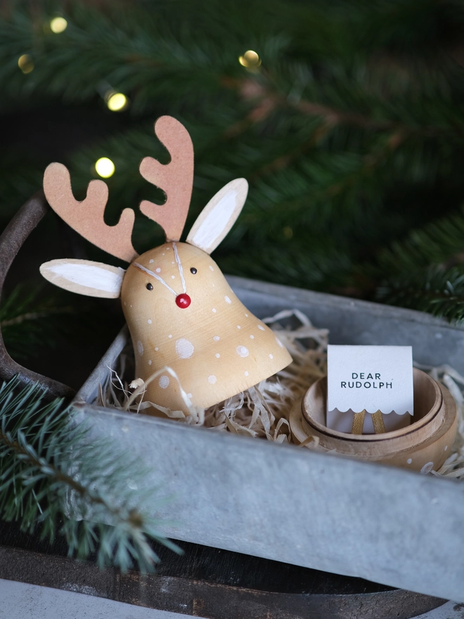 Handcrafted wooden Rudolph Christmas decoration opened to reveal a tiny “Dear Rudolph” note, 