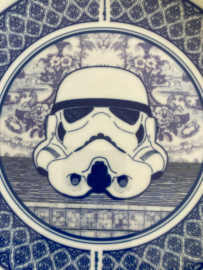Delft style blue and white 8" plate featuring a Stormtrooper head in the centre