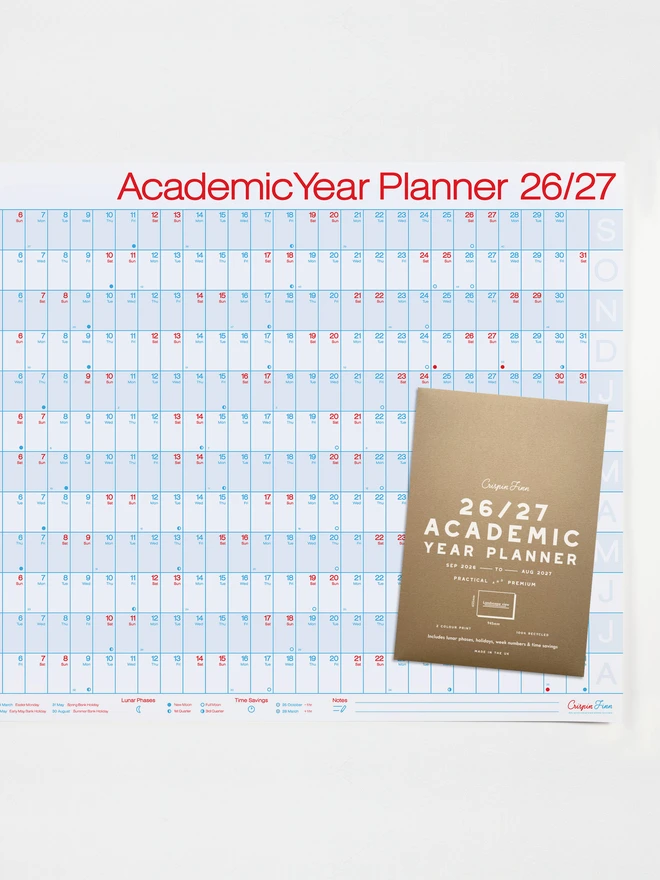 Photo of an academic year planner for the year 2026-2027 design in red and blue on 100% recycled white paper