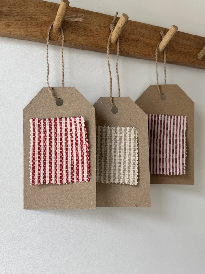 Striped Embroidered Christmas Stocking. A selection of striped linens on a swatch