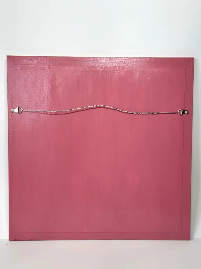 back view of wooden painted mirror in pink