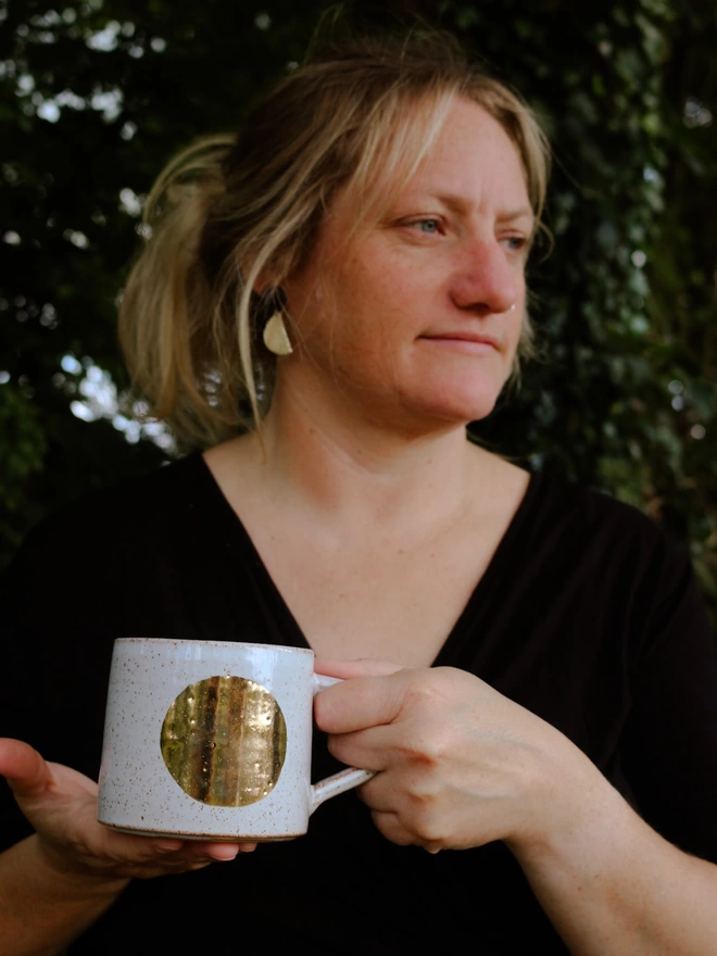 Laura Lane Ceramics holding her Luna Mug