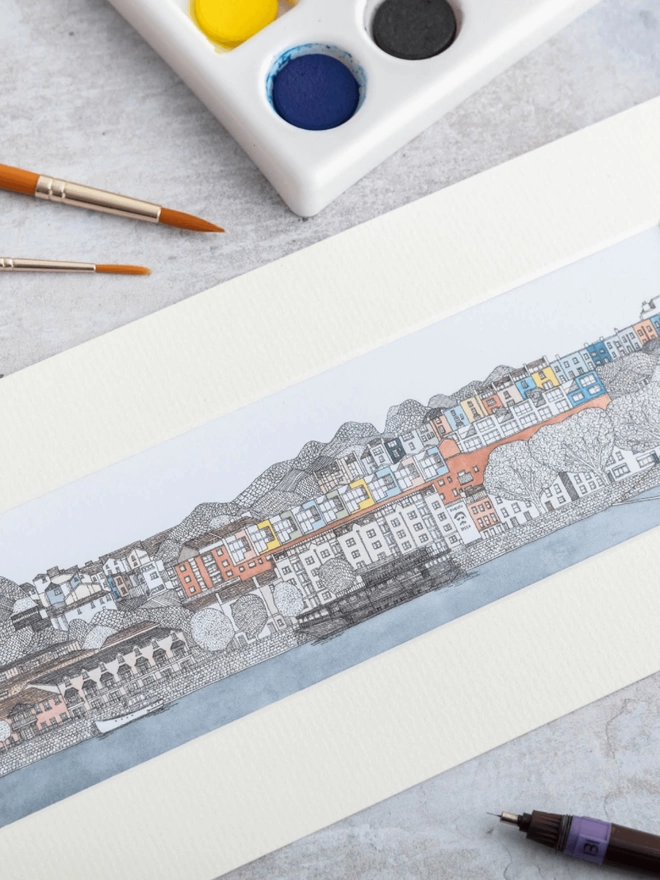 Print of detailed pen and watercolour drawing of Bristol harbour and colourful houses, in a soft white mount