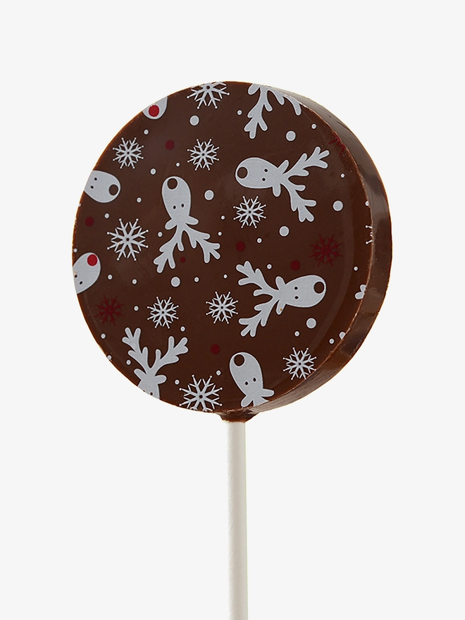 A milk chocolate lollipop with a festive Christmas design