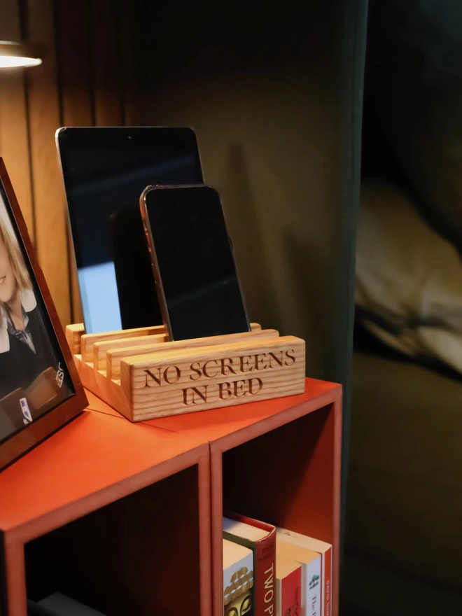 Bedside table with phones and phone stand