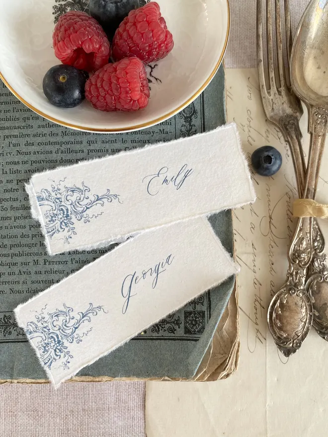 soft edge handmade paper place names with ornate design