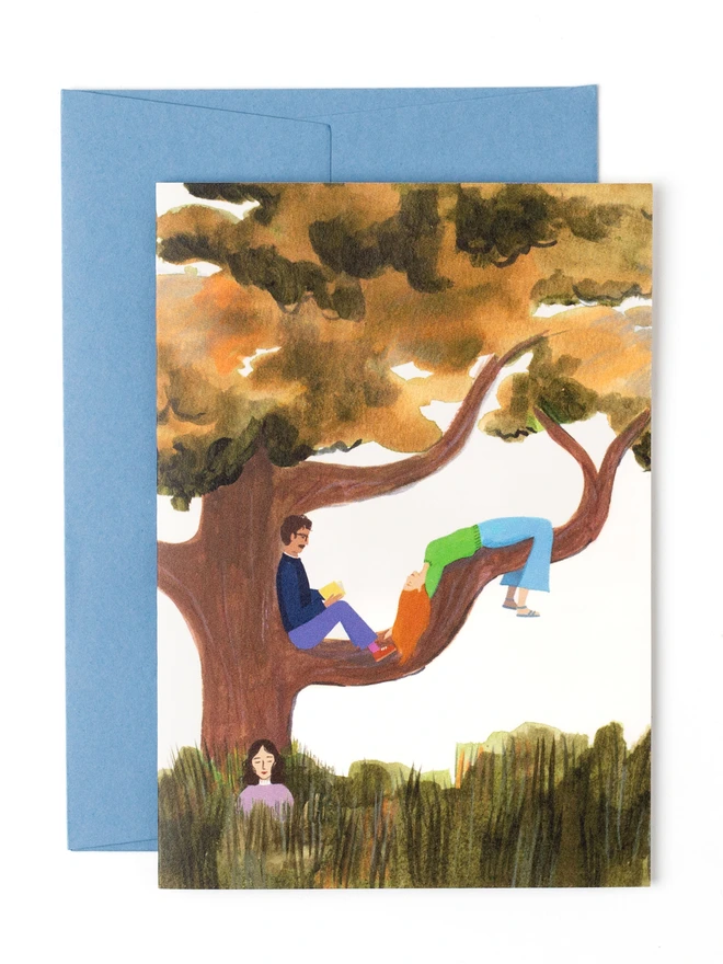 A greetings card featuring an illustration of three friends lounging on the big branches of a tree. One of the friends is sitting at the base of the tree with their eyes closed.