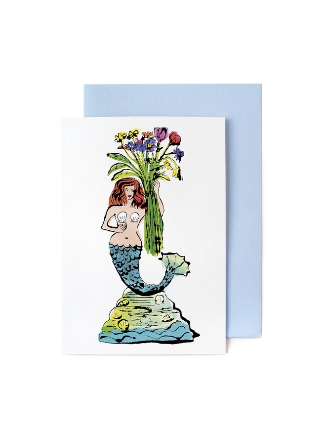 Greeting card with blue envelope featuring a pen and ink illustration of a mermaid holding flowers on Staffordshire antique ceramic.