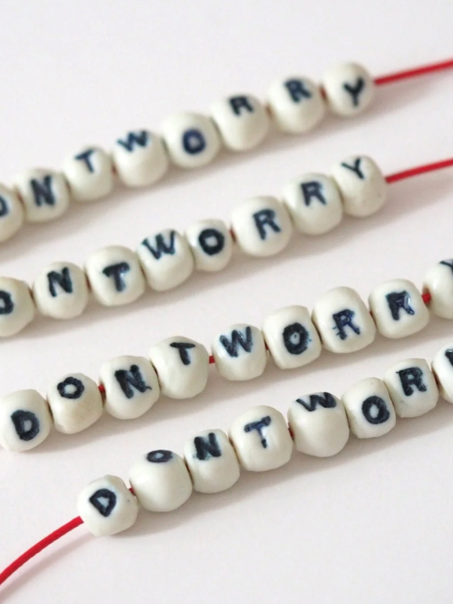 Don’t Worry necklace. A row of don’t worry necklaces.