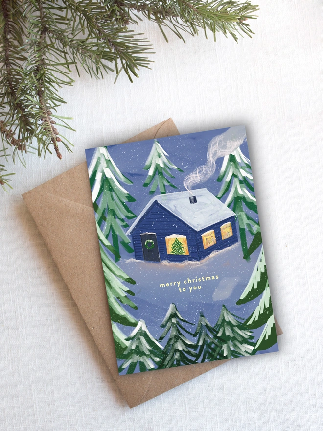 Cosy cabin illustrated Christmas Card