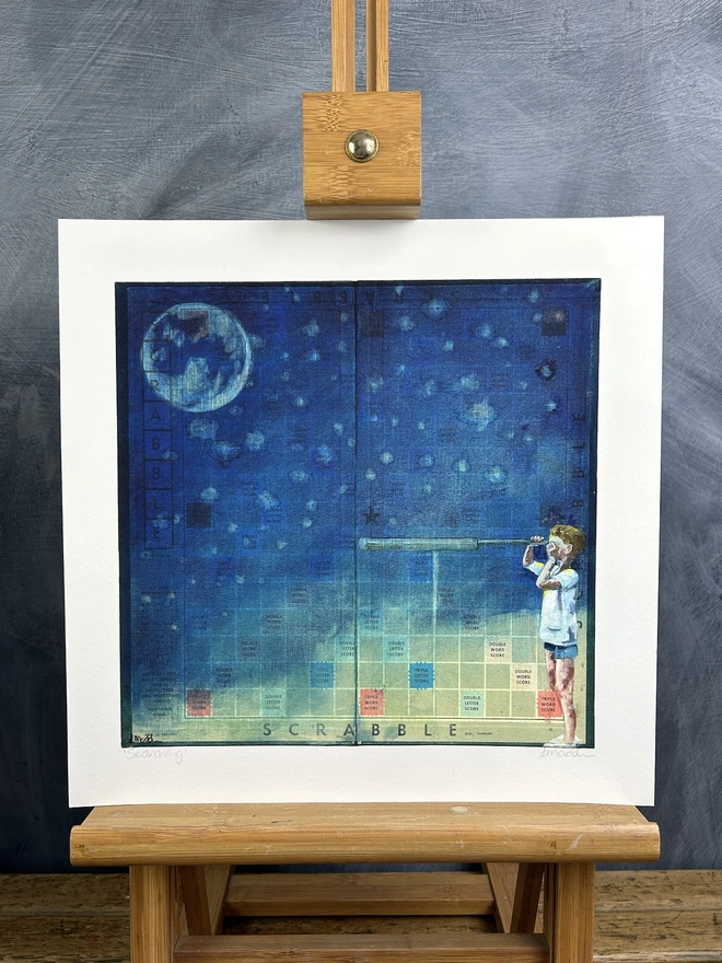 print of a little boy looking through a telescope looking at the moon painted onto a vintage scrabble board