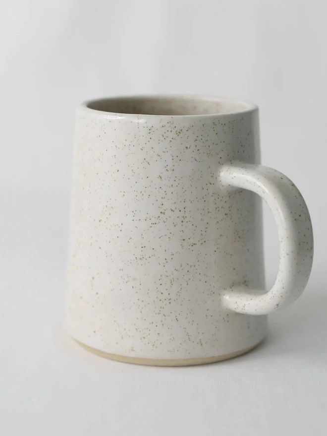 Ceramic Pint Mug, a colourful ceramic mug sitting on a white surface against a plain backdrop. 