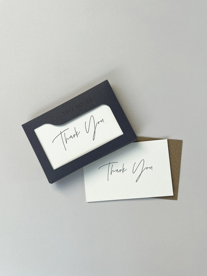 Boxed letterpress tiny note illustrated with a thank you in modern calligraphy