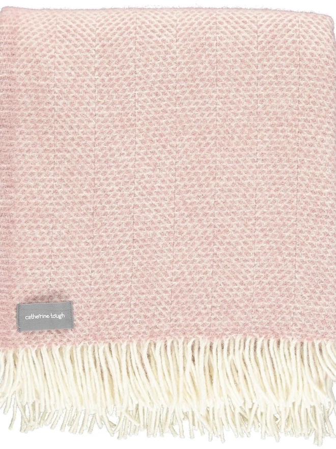 Organic Wool Throw, an organic wool throw folded on a white surface. 