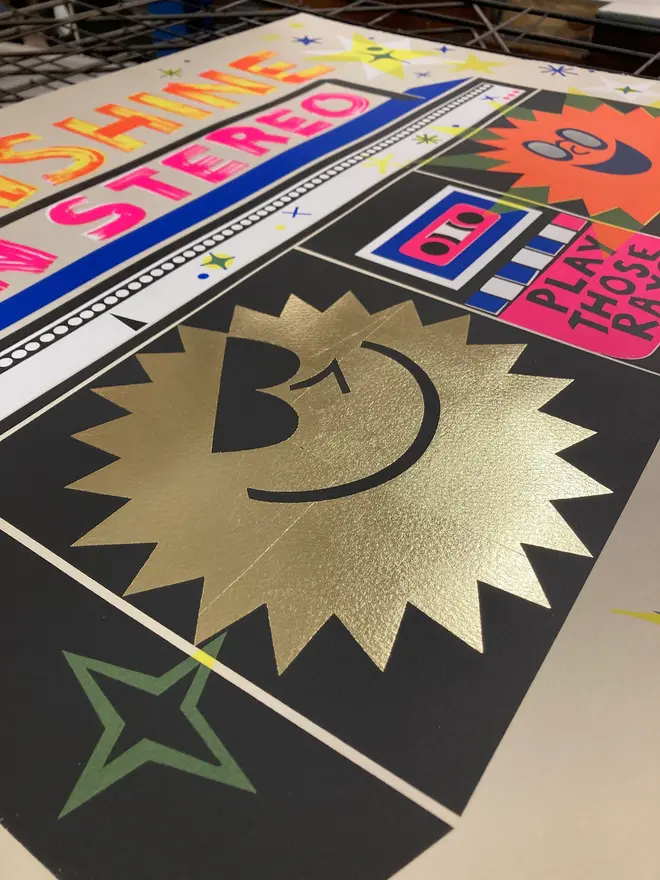 'Sunshine In Stereo' Screenprint, a group of colourful stereo screenprints on a studio rack. They read 'Sunshine in stereo. 