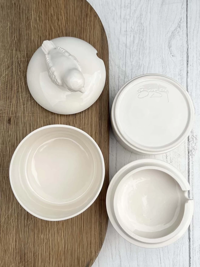 Sugar pots and lids are shown from different angles.