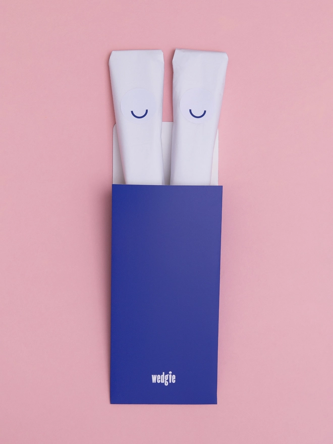 Wedgie, against a pink background. 