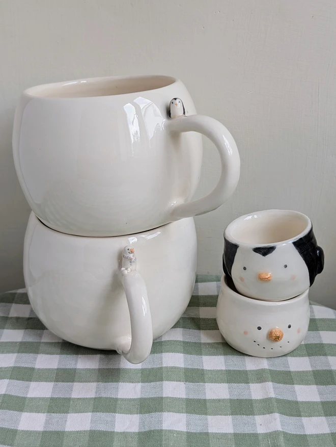 snowman and penguin ceramic egg cups