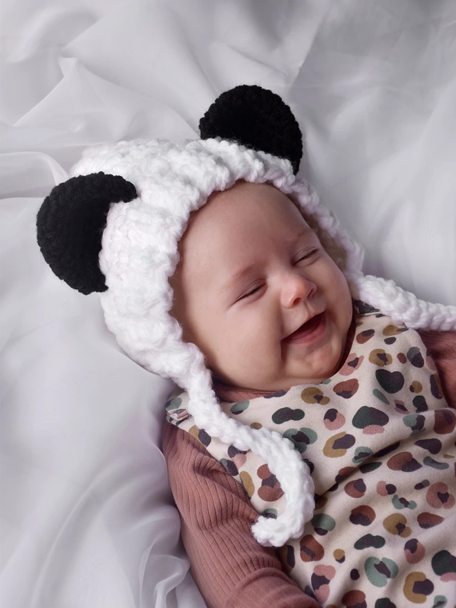 Baby wearing Panda bonnet