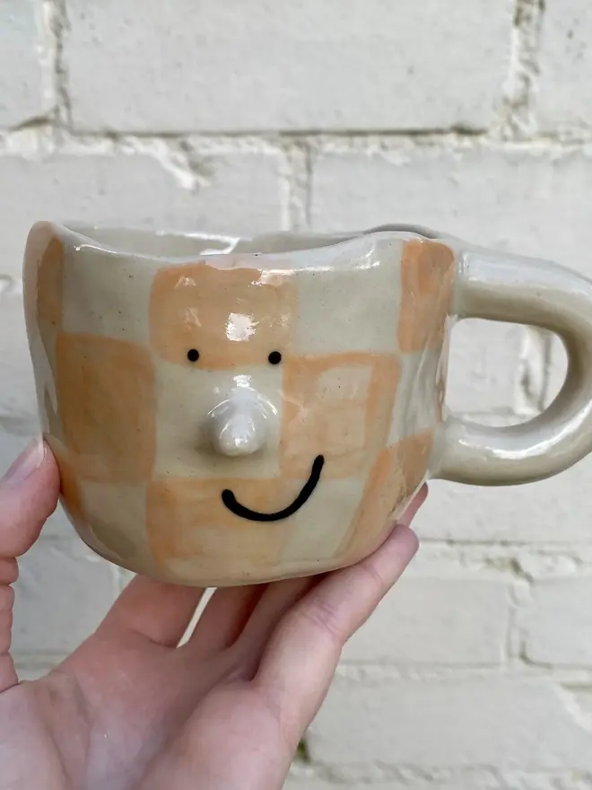 peachy checked handmade ceramic smiley face mug