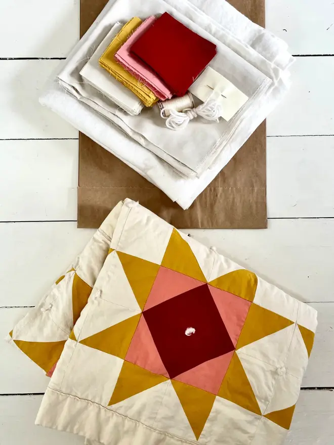 Warm Hearth Quilt Kit, on the floor. 