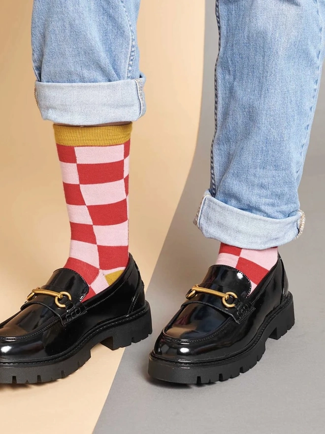 Women's Organic Cotton Ankle Socks Packs (Sets Of 3), a person wearing a pair of colourful patterned socks. 