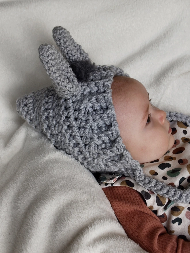 Side view of Donkey bonnet being worn by a baby