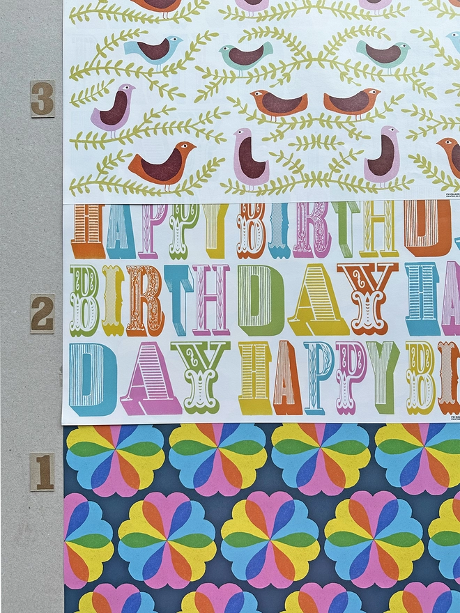 Wrapping paper options of 1: hearts & flowers, 2: Happy Birthday, 3: folk birds