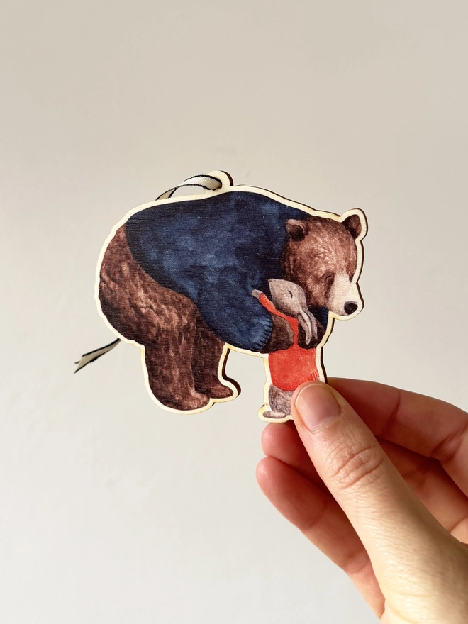 Bear hug decoration in hand
