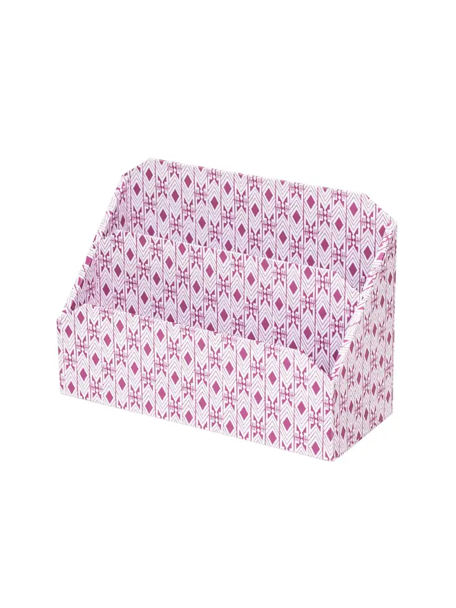 Tijan Letter Rack, a colourful patterned letter rack sitting on a white surface against a plain backdrop. 